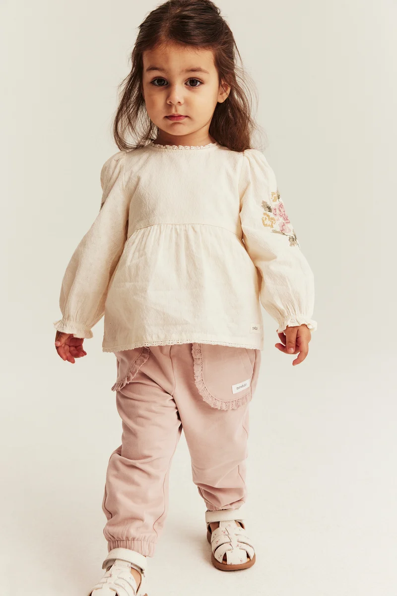 Baby pink joggers with lace details
