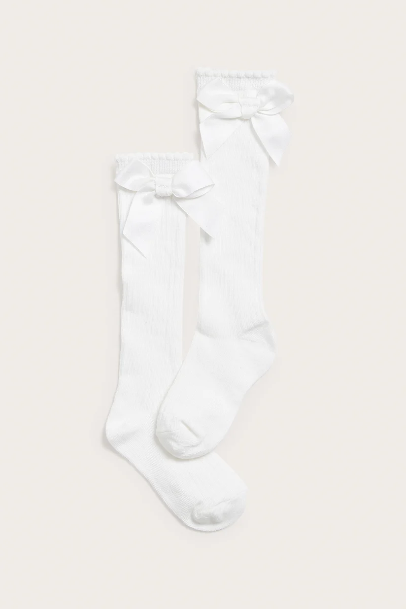 Kids white knee-high bow socks