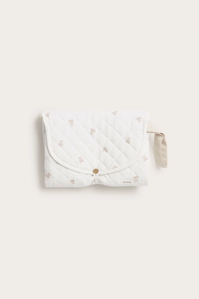 Foldable white changing mat with teddy bears