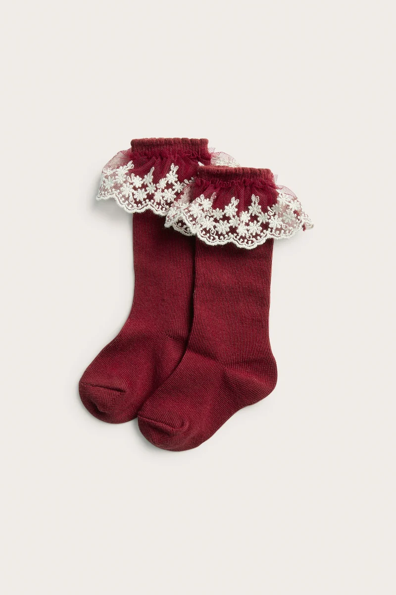Baby red knee-highs with embroidered frill
