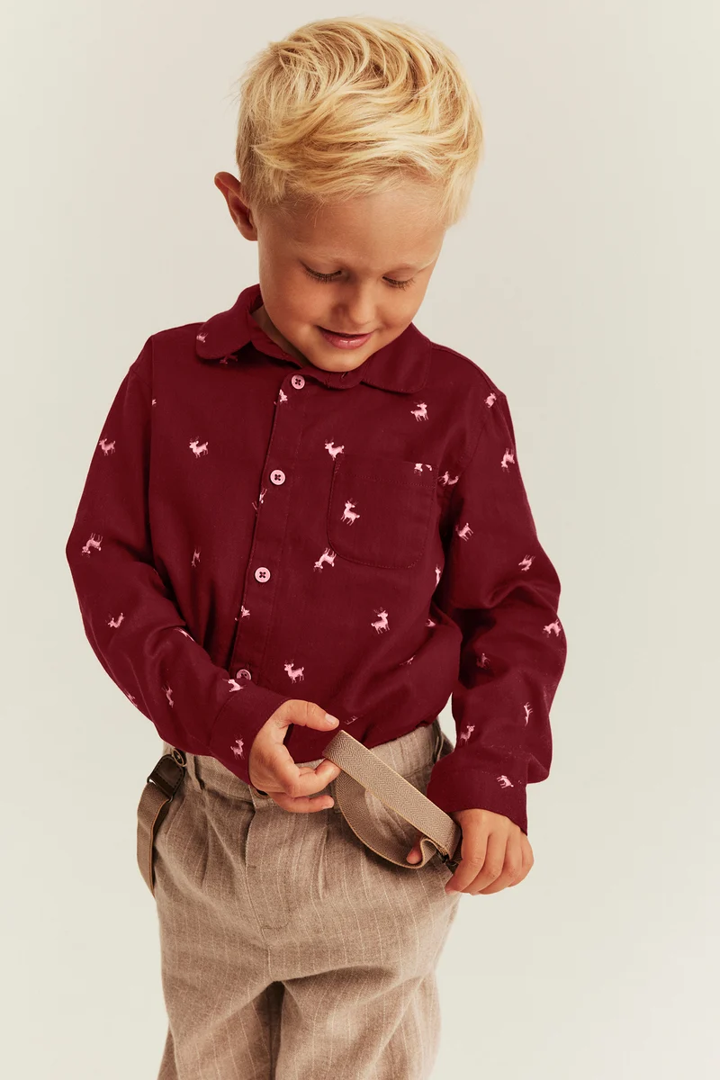 Kids red shirt with reindeer pattern