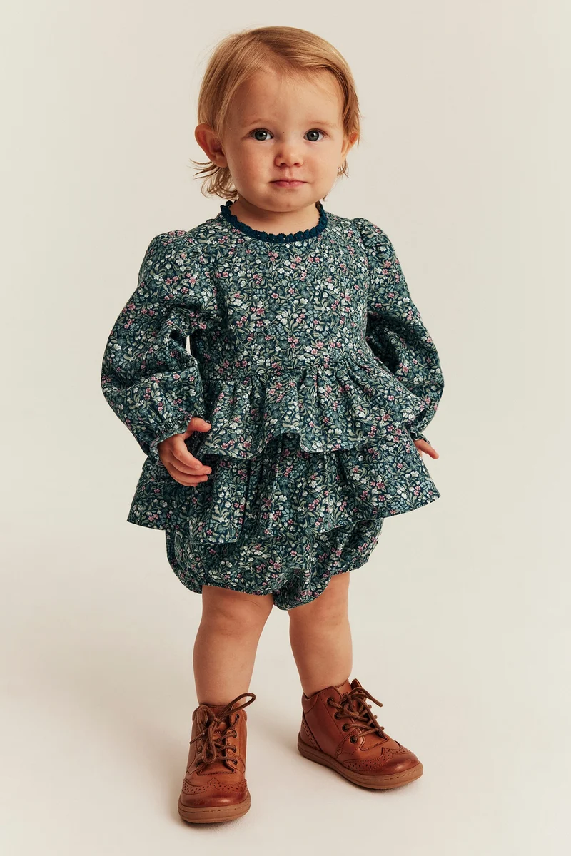 Baby turquoise floral bodysuit with frill