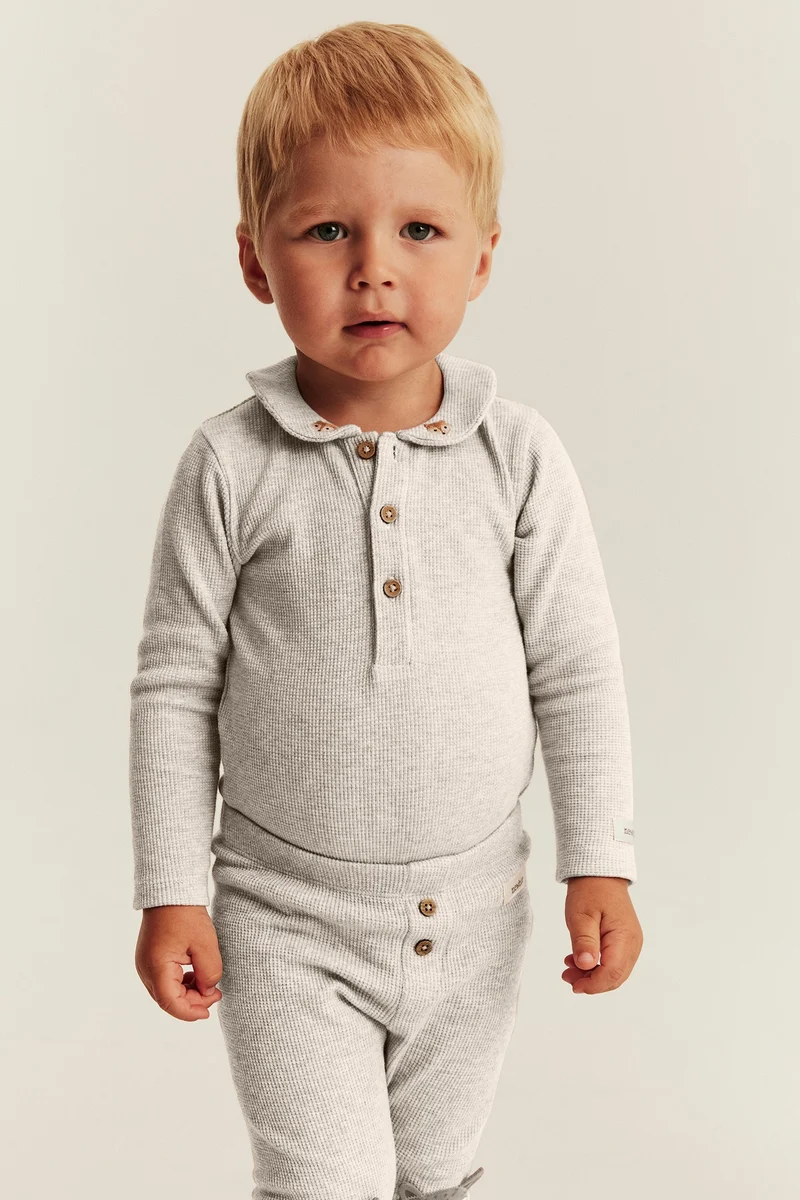 Baby beige long sleeve waffle bodysuit