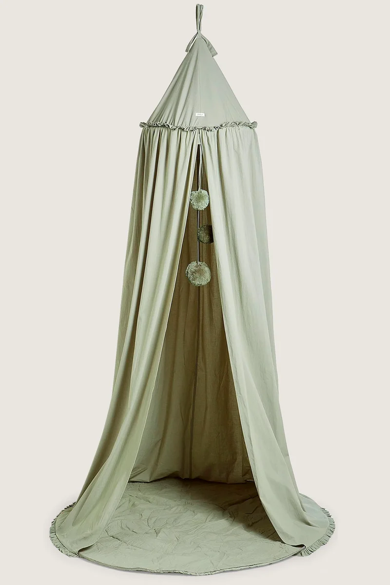 Green reading tent with pom-poms